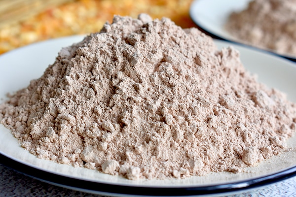 Powdered tricalcium phosphate feed additive for livestock poultry and aquatic animals